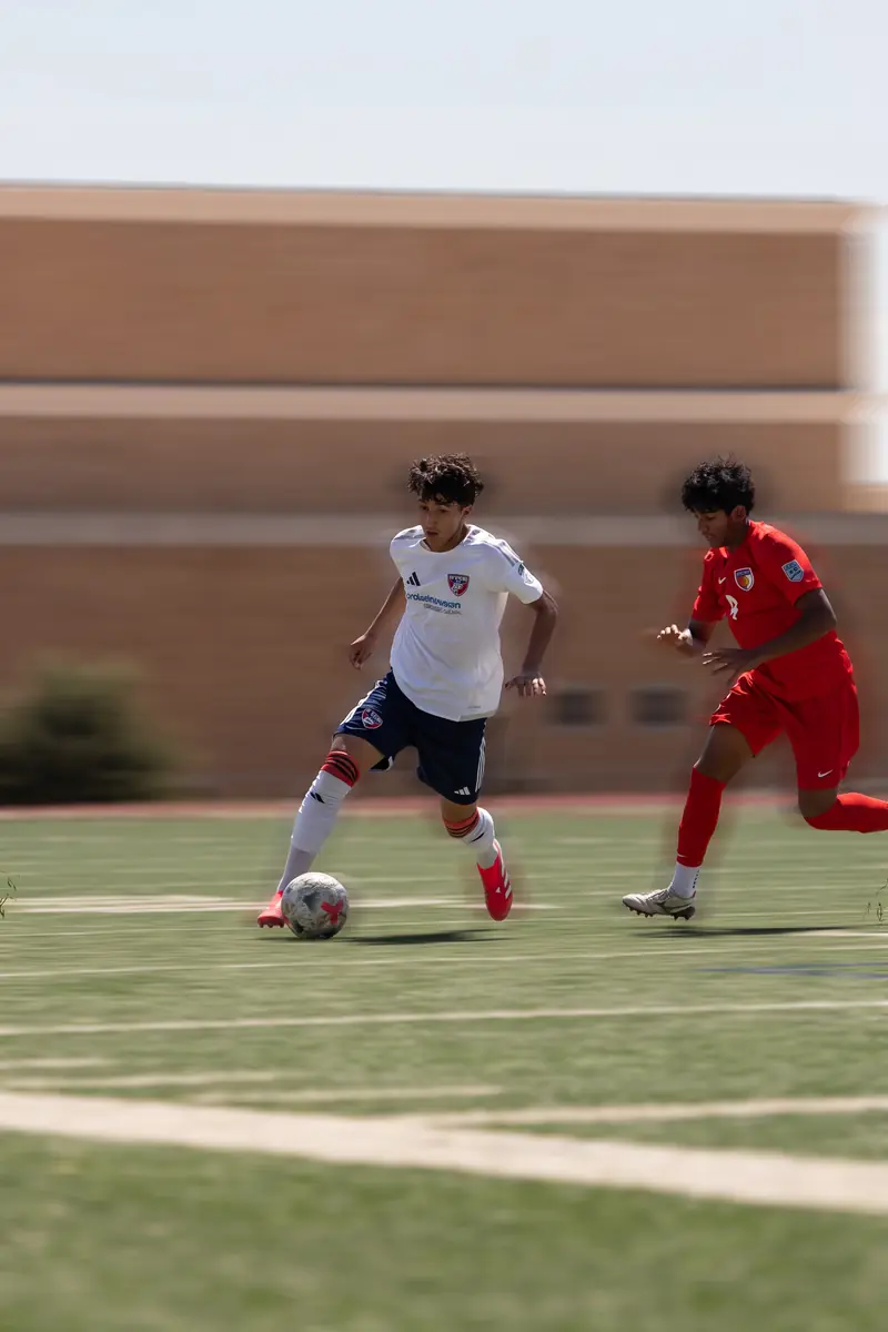 FC Dallas player breaking away with the ball, motion blur edit