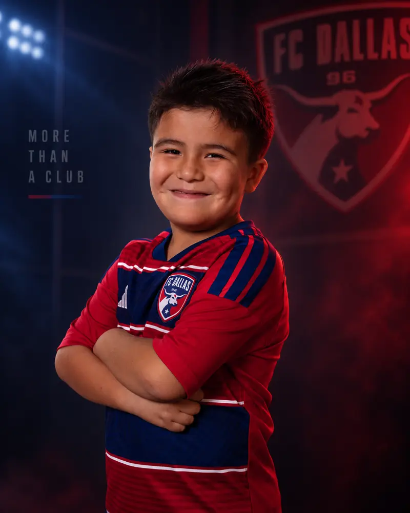 Youth FC Dallas player media day portrait, arms crossed, edited onto a club crest background